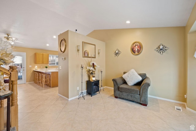 sitting room featuring light tile patterned floors, baseboards, lofted ceiling, visible vents, and recessed lighting