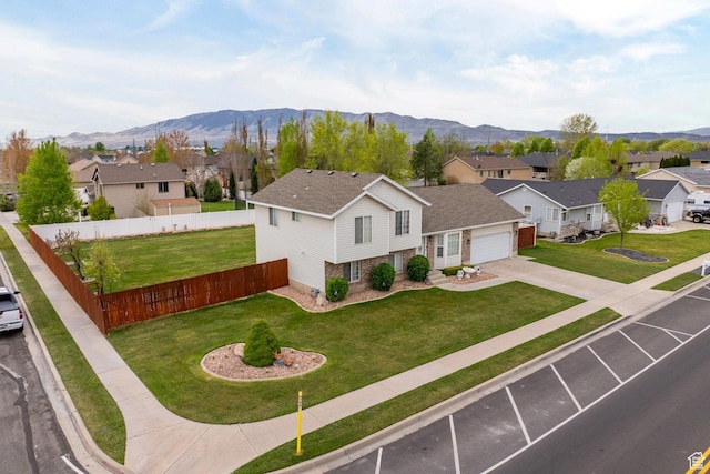 drone / aerial view featuring a mountain view and a residential view
