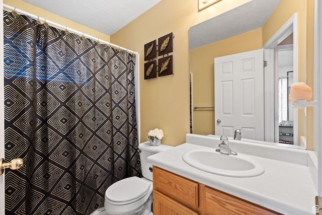 full bath featuring toilet and vanity