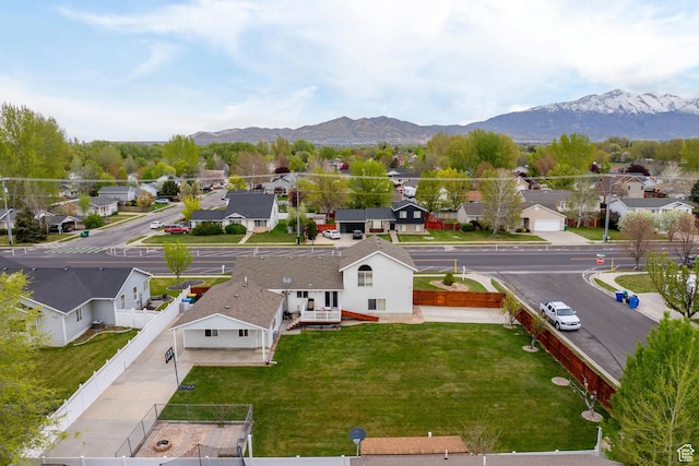 birds eye view of property with a residential view and a mountain view