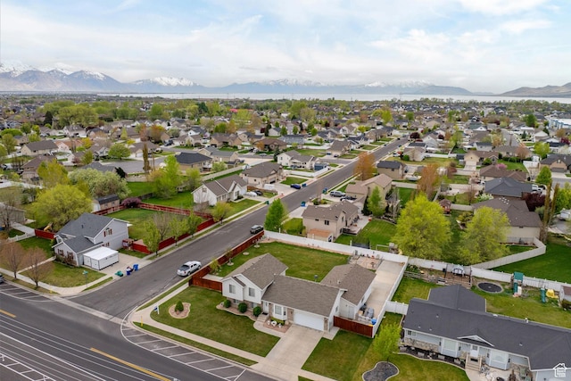 birds eye view of property featuring a mountain view and a residential view