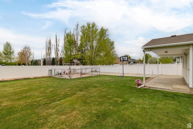 view of yard featuring a patio area and a fenced backyard