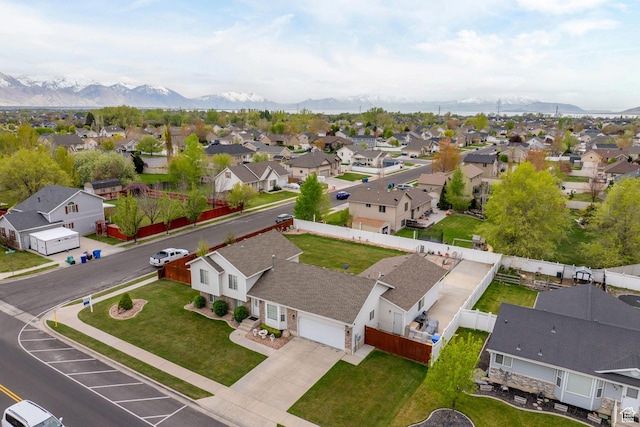drone / aerial view with a residential view and a mountain view