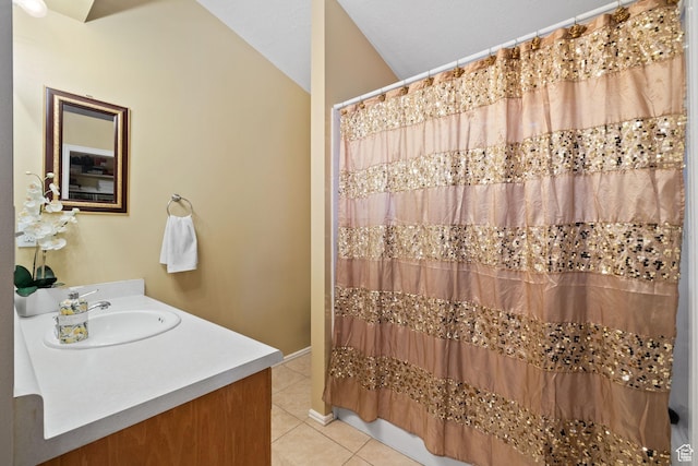 full bath with a shower with shower curtain, tile patterned floors, and vanity