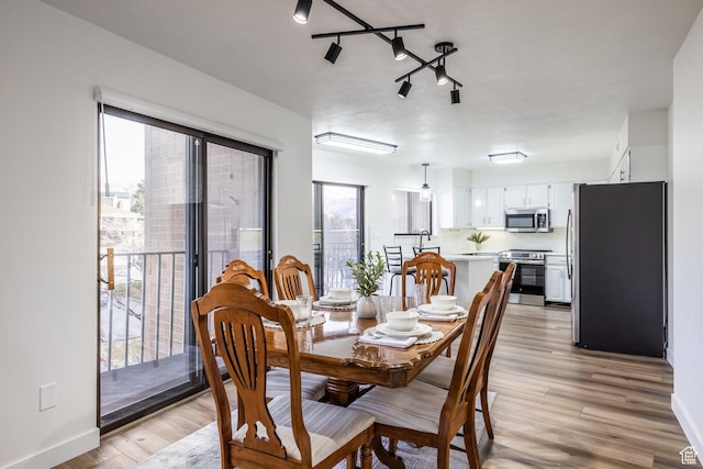 245 N Vine St W Unit 501, Salt Lake City, UT 84103 - dining room with light hardwood / wood-style floors