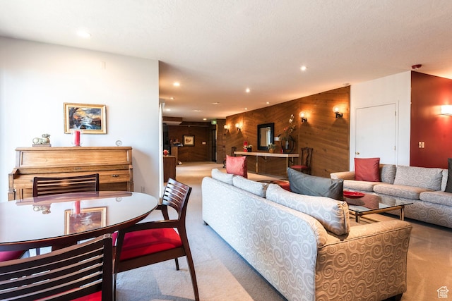 245 N Vine St W Unit 501, Salt Lake City, UT 84103 - carpeted living room featuring a textured ceiling and wooden walls