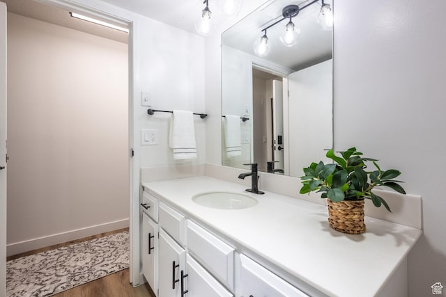 245 N Vine St W Unit 501, Salt Lake City, UT 84103 - bathroom with hardwood / wood-style flooring and vanity