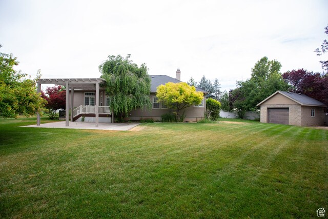 3684 W 850 N, Layton, UT 84041 - view of yard with a pergola, a patio area, a garage, and an outdoor structure