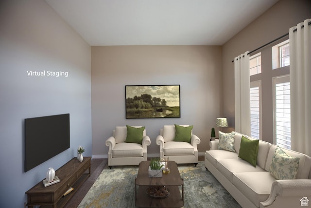 living room with wood finished floors and baseboards