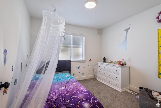 bedroom featuring light carpet