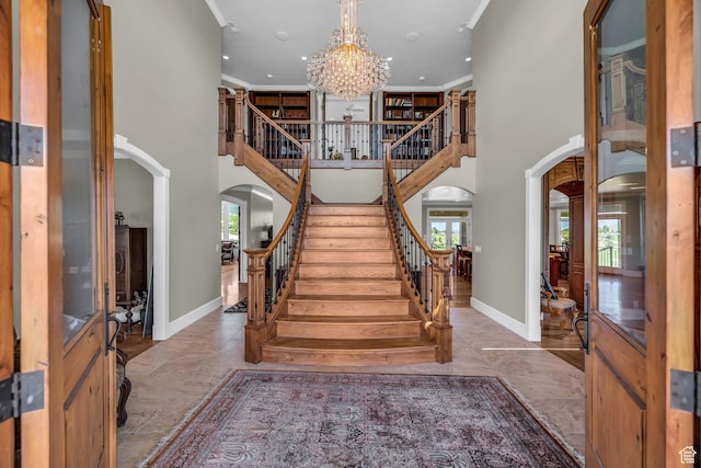 2410 E Center Creek Rd, Heber City, UT 84032 - foyer entrance featuring a high ceiling, crown molding, and an inviting chandelier