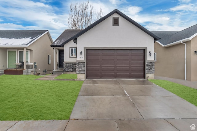 view of front facade with a garage and a front yard