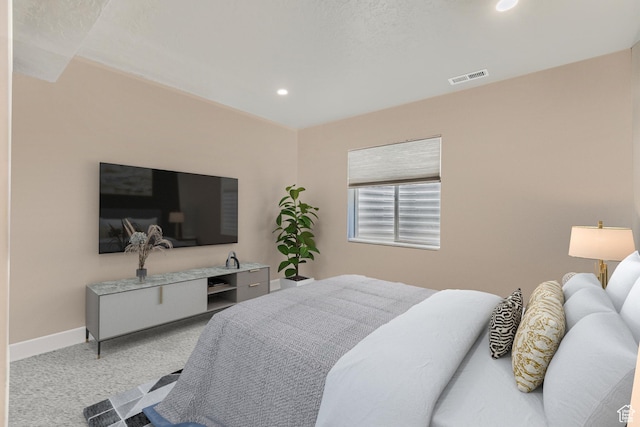 bedroom featuring light colored carpet