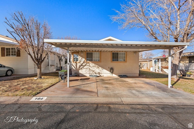 view of front of property with a carport