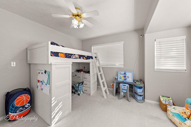 bedroom with light carpet and ceiling fan