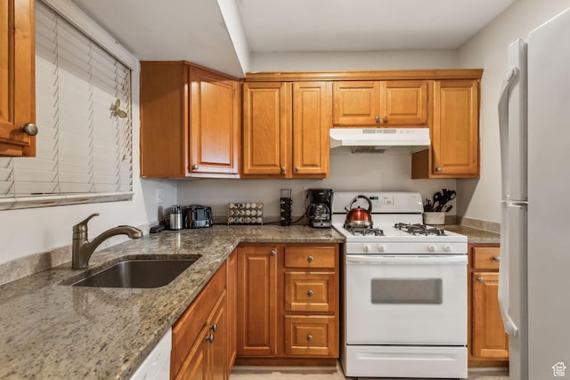251 S 700 E Unit 11, Salt Lake City, UT 84102 - kitchen with light stone countertops, sink, and white appliances