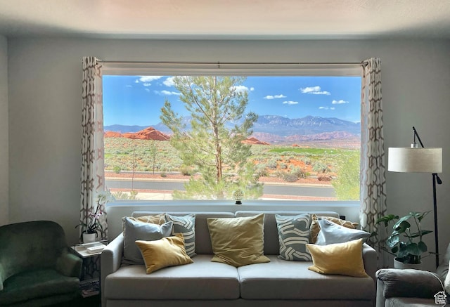living room with plenty of natural light and a mountain view