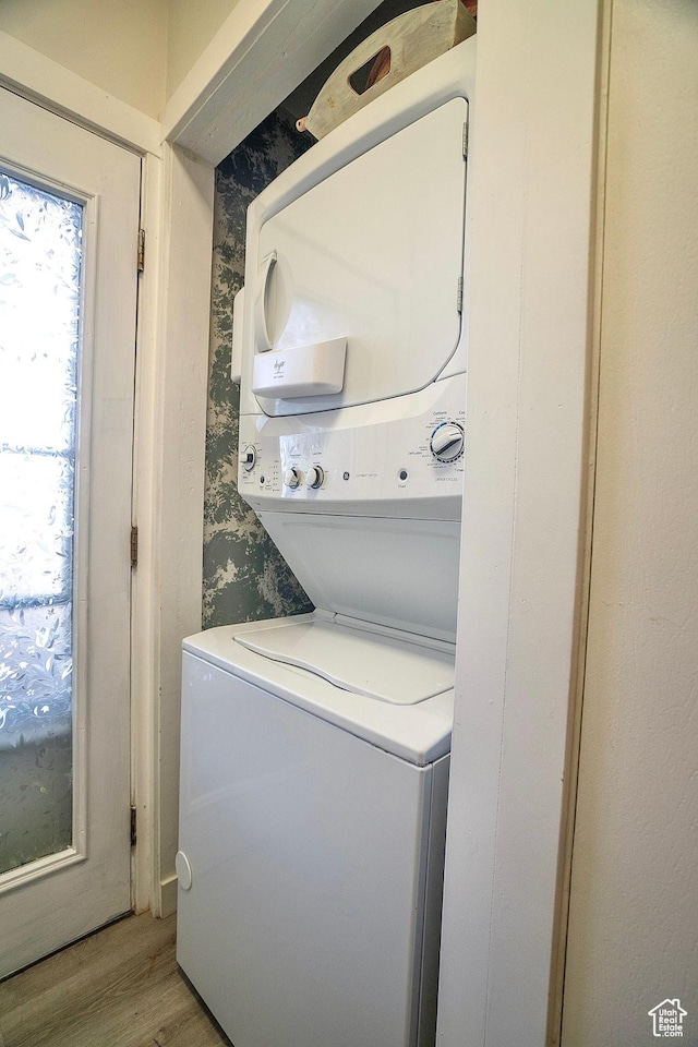 5338 S Beacon Hill Cir W Unit 181, Salt Lake City, UT 84123 - clothes washing area with stacked washer and dryer and light wood-type flooring