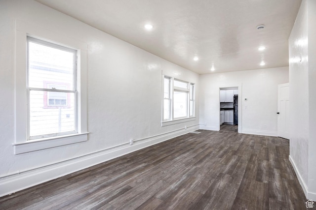 unfurnished room featuring dark hardwood / wood-style floors