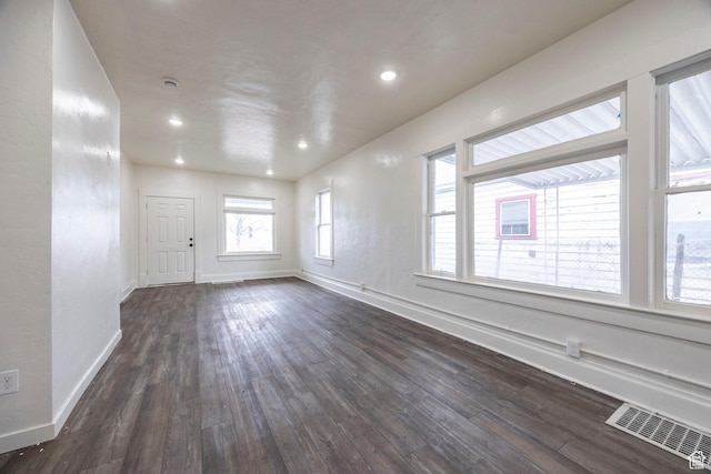 empty room featuring dark hardwood / wood-style flooring