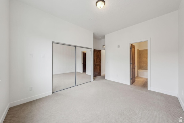6169 Park Ln Unit 37, Park City, UT 84098 - unfurnished bedroom with ensuite bathroom, light carpet, and a closet