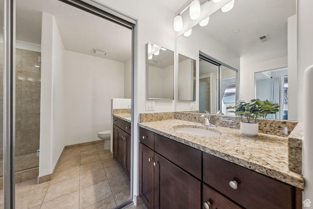 6169 Park Ln Unit 37, Park City, UT 84098 - bathroom with tile patterned flooring, vanity, tiled shower, and toilet