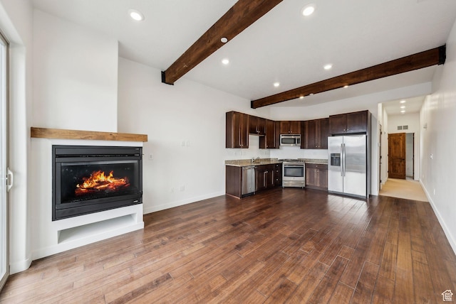 6169 Park Ln Unit 37, Park City, UT 84098 - kitchen with hardwood / wood-style floors, dark brown cabinets, beamed ceiling, and appliances with stainless steel finishes