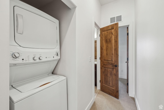 6169 Park Ln Unit 37, Park City, UT 84098 - laundry area featuring light carpet and stacked washing maching and dryer