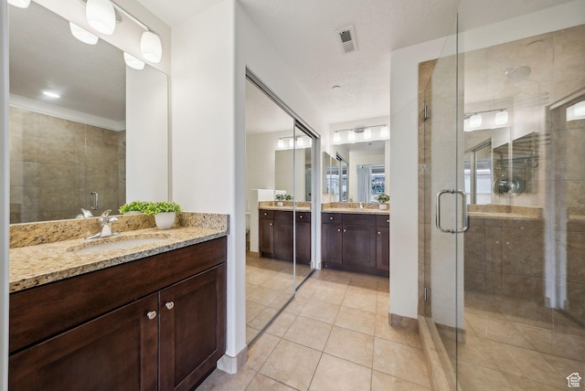 6169 Park Ln Unit 37, Park City, UT 84098 - bathroom with tile patterned floors, a shower with shower door, and vanity