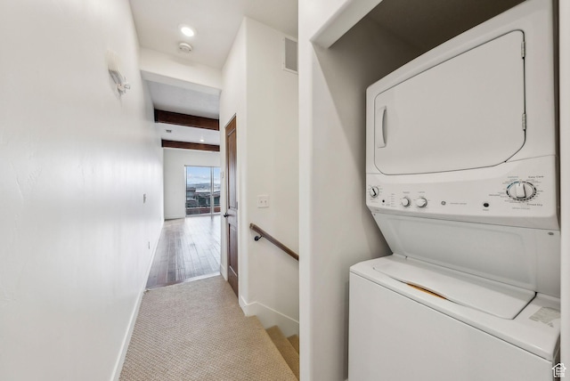 6169 Park Ln Unit 37, Park City, UT 84098 - laundry area with stacked washer / dryer and light colored carpet