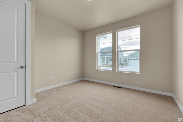 622 W Junegrass Ln, Stansbury Park, UT 84074 - spare room featuring light carpet