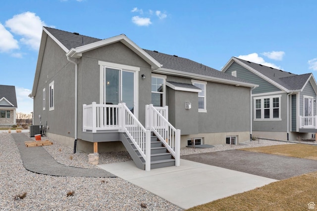 622 W Junegrass Ln, Stansbury Park, UT 84074 - back of property featuring central AC and a patio area