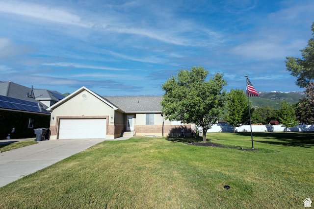 ranch-style house with a garage and a front yard