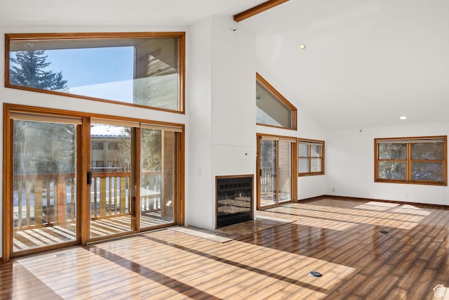 515 Saddle View Way Unit 23, Park City, UT 84060 - unfurnished living room featuring wood-type flooring, high vaulted ceiling, and beamed ceiling