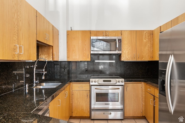 515 Saddle View Way Unit 23, Park City, UT 84060 - kitchen with sink, light tile patterned floors, dark stone countertops, backsplash, and stainless steel appliances