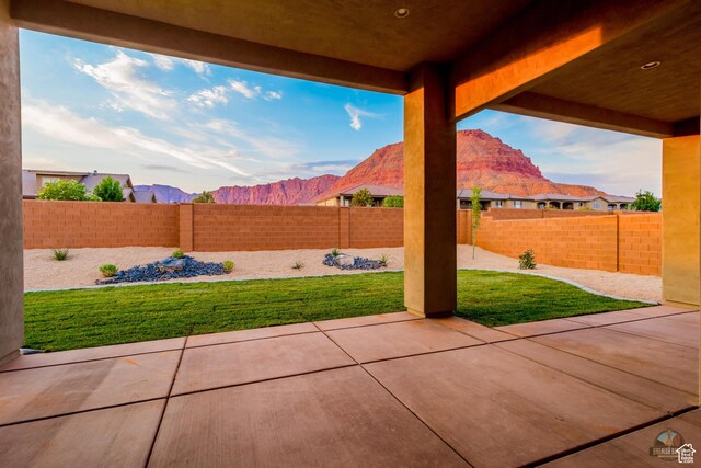378 W Redstone Ct, Ivins, UT 84738 - view of patio / terrace with a fenced backyard and a mountain view