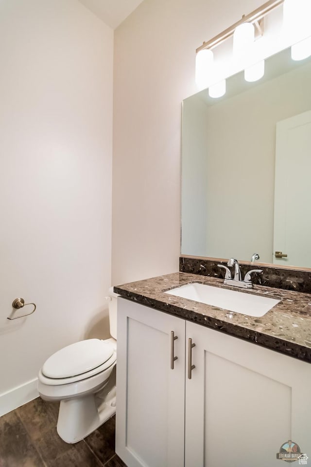 378 W Redstone Ct, Ivins, UT 84738 - half bathroom featuring vanity, toilet, and wood finished floors