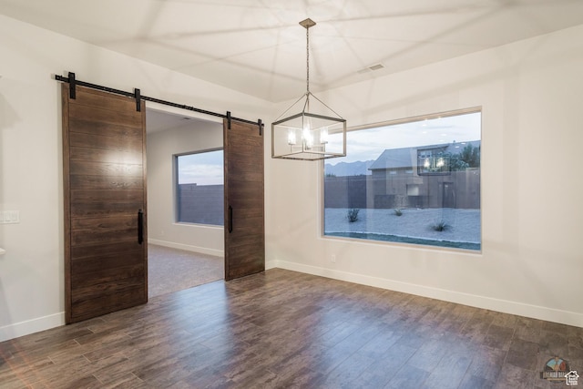 378 W Redstone Ct, Ivins, UT 84738 - spare room featuring a barn door, visible vents, and dark wood-style flooring