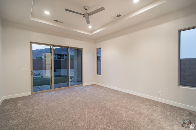 378 W Redstone Ct, Ivins, UT 84738 - carpeted spare room featuring a tray ceiling, visible vents, and baseboards