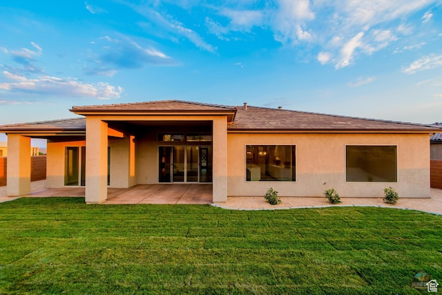 378 W Redstone Ct, Ivins, UT 84738 - back of property with a lawn, a patio area, and stucco siding