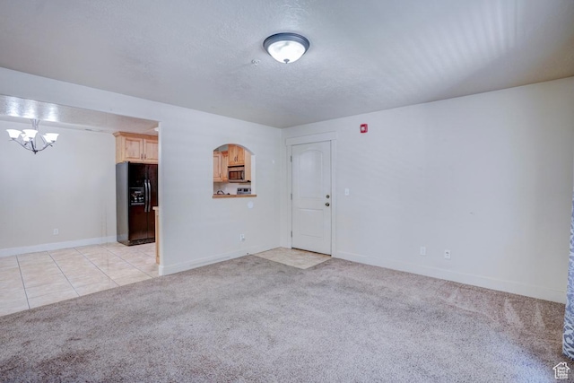 1045 S 1700 W Unit 412, Payson, UT 84651 - unfurnished room featuring a chandelier, light colored carpet, and light tile patterned floors