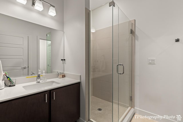 bathroom with vanity and an enclosed shower