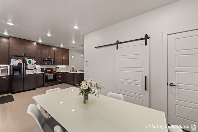 dining space with a barn door