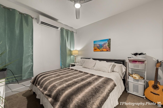 carpeted bedroom featuring a wall unit AC and ceiling fan