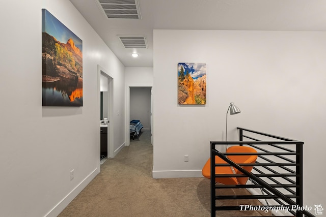 corridor featuring carpet flooring