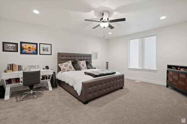 bedroom featuring light carpet and ceiling fan