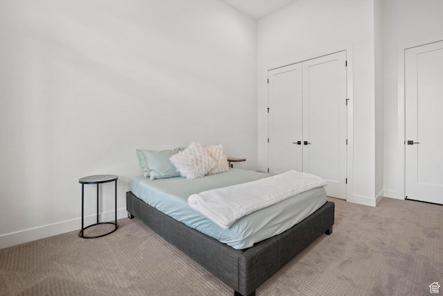 carpeted bedroom featuring a closet