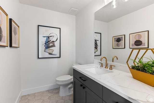 68 E Watson Dr S, Saratoga Springs, UT 84045 - bathroom featuring tile patterned flooring, vanity, a textured ceiling, and toilet