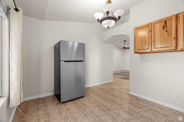 3561 W 290 N, Hurricane, UT 84737 - kitchen featuring stainless steel fridge, ceiling fan with notable chandelier, light brown cabinets, and light tile patterned floors