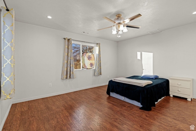 3561 W 290 N, Hurricane, UT 84737 - bedroom with ceiling fan, a textured ceiling, and dark hardwood / wood-style flooring